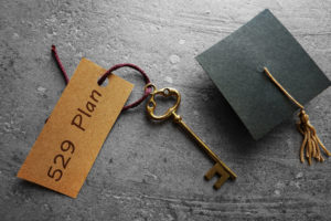 Picture of graduation cap and key to college savings